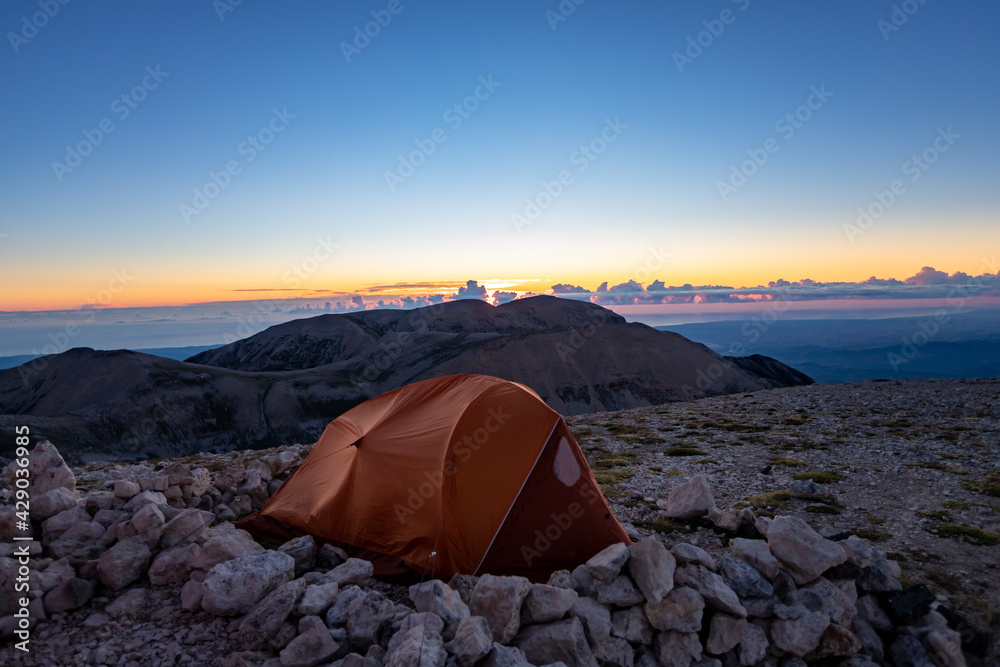 Wall mural pelino bivouac on the top of monte amaro at sunrise. trekking in the majella national park, the seco