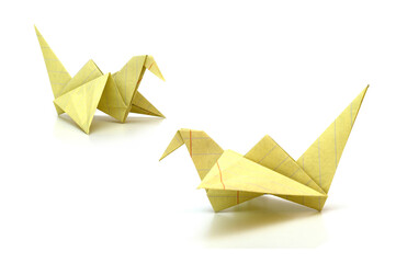 Origami bird isolated with paper school sheet