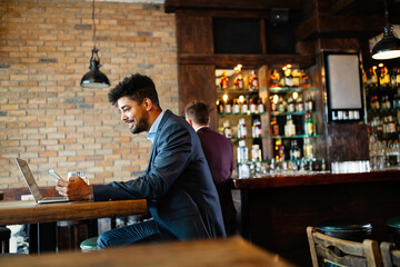 Young business man having a break in a restaurant. Work occupation business lifestyle concept