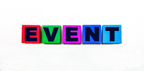 The word EVENT is written on colorful cubes on a light background