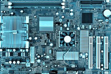 Fototapeta premium Motherboard, printed circuit board in a desktop personal computer. Teal colored, Cyberpunk design.