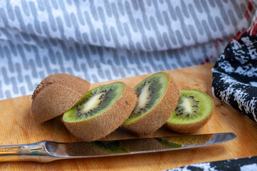  kiwi halves on a cutting board on a table close-up. background with kiwi fruit close-up.
