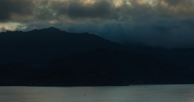 Timelapse video of breathtaking summer sunset landscapes, mountainous, misty and full of clouds, on the Galician coast, Ortigueira, near Cape Ortegal, La Coru&ntilde;a province, Spain.