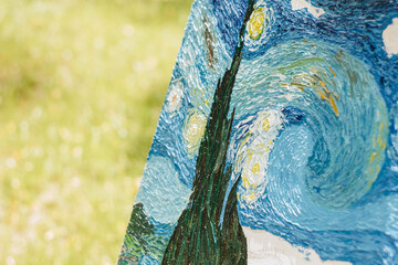 part of a painting drawn with oil paints on a background of a green lawn close-up. Van Gogh's...