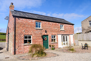 Pretty converted Irish barn house cottage with stable door and sliding barn doors.
