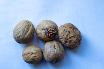 walnuts with unujual shell on a blue background