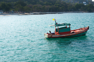 Fototapeta na wymiar small colorful boat floating on the sea