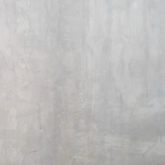 The plastered wall is gray. The wall inside the room. Background picture with scratches. Architecture and construction. Interior design. Copy space for text.