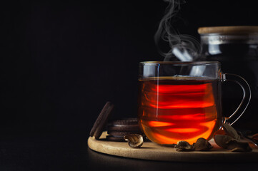 Black tea with cookies on the table