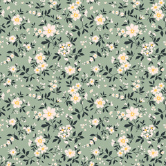 Trendy seamless vector floral pattern. Endless print made of small white flowers. Summer and spring motifs. Green gray background. Stock vector illustration.
