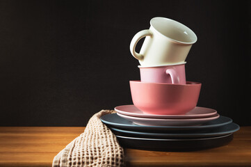 Clean dishes stands on a wooden table