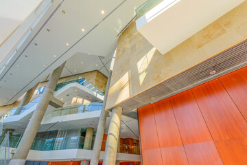 Obraz premium Painted in brown. Abstract fragment of the architecture of modern lobby, hallway of the luxury hotel, shopping mall, business center in Vancouver, Canada. Interior design.