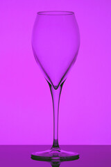 wine glass on a purple-pink background, abstraction