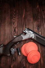 Clay target plates for shooting with rifle on wooden back