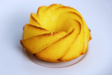 Salty muffin with cheese and corn flour on white plates