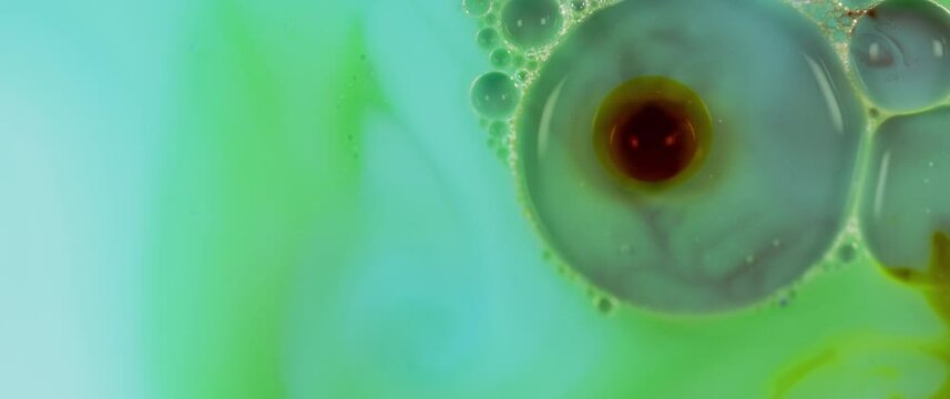 Macro Textures with Vibrant Neon Color Palette. Abstract Background Made with Oil Mixed with Green and Teal Dye, Ink, and Paint.