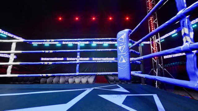 Blue corner empty boxing arena in the light of a spotlight 4k video. High quality 4k footage
