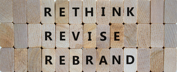 Rethink, revise, rebrand symbol. Wooden blocks with words 'rethink, revise, rebrand'. Beautiful wooden background. Business, rethink, revise, rebrand concept. Copy space.