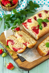 Delicious summer dessert gluten free strawberry pie, cake with strawberries on a wooden table.