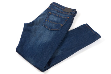 Blue jeans isolated on white background. Folded casual style trousers or pants. 