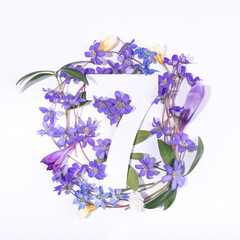 Layout with spring flowers and number seven. Anniversary concept.