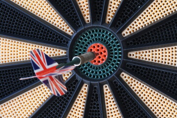 Dart with the flag of England stuck in the center of the target