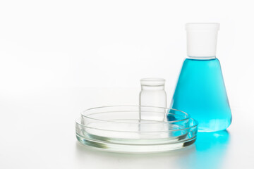 Chemistry glassware with blue liquid for science research and experiment. Close up.