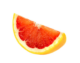 Slice of grapefruit close-up isolated on white background.