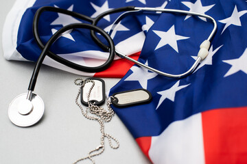 army badge on the background of the american flag, stethoscope