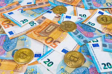 Bitcoin coins on euro banknotes. Stock Market of cryptocurrencies and decentralized finances concept