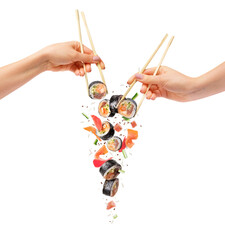 Falling sushi rolls with wooden chopsticks in female hands, isolated on white background