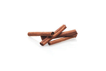 Cinnamon sticks isolated on white background. Close up view of the group fragrant cinnamon sticks.