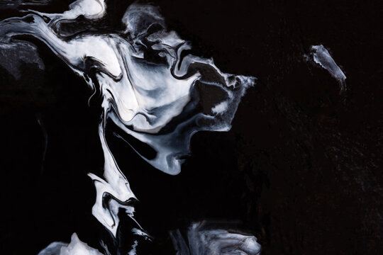 Black and white abstract acrylic background. Fluid art texture. Imitation of the marble effect, painting. The concept of Black Friday. A form for texts, presentations,and websites. Artistic background