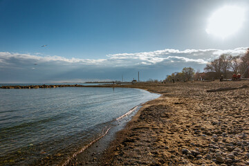 Looking west from Kew Beach in Toronto's Beaches neighbourhood toward the Leuty Lifeguard Station, downtown and the CN Tower on a spring afternoon.
