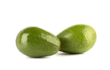 Two avocados isolated on a white background.