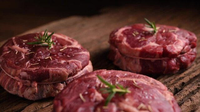 Fresh raw beef meat on wooden prank