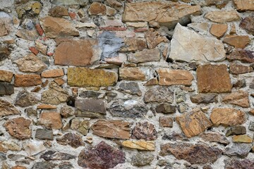 stone wall of old abandoned and dilapidated house in the Tuscan countryside in Italy