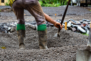 Workers on the field. Moving dirt to make gardens. 