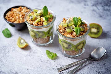 Kiwi Greek yogurt granola parfait in a glass