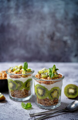 Kiwi Greek yogurt granola parfait in a glass