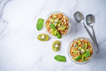 Kiwi Greek yogurt granola parfait in a glass
