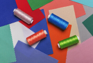 Colored threads on bobbins blue, green ,red.