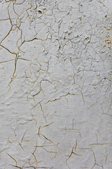 Shabby old paint background. Vintage ancient background. Gray tint of textured old wall. Cracked paint
