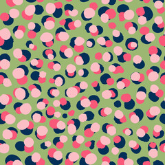 Multicolored doodle dots seamless repeat pattern. Vector circle elements overlapped all over print on green background.
