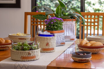 Baskets made of woven palm leaves served at the table with salad and ice, ready to start eating. handmade and traditional product of latin america and mexico.