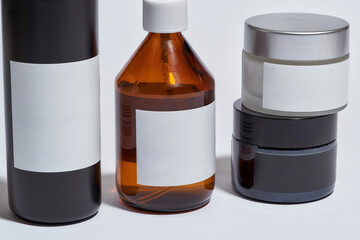 Close up view of cosmetological bottles with empty labels