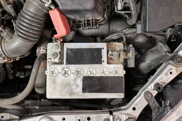 Old starter battery in a car