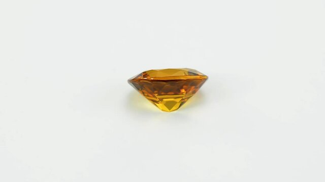Natural golden yellow tourmaline oval facveted gemstone high quality finish and polish. Great proportions. Rare color. Unheated. 100% natural precious stone. Usage for jewelry making. Gray background.