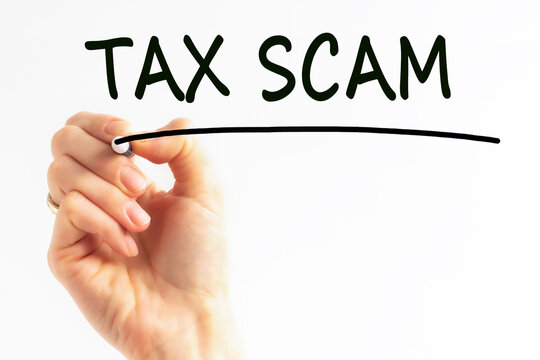 hand writing inscription tax scam with marker, concept, stock image
