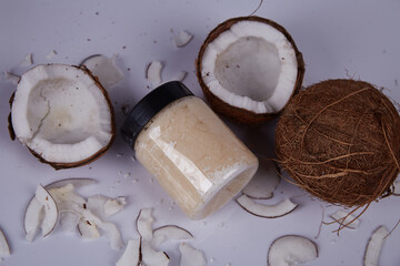 Juicy fresh coconut tropical super food organic nutrition healthy lifestyle  jar with milk oil dessert sugar free diet or cosmetic for body skin care cream lotion.